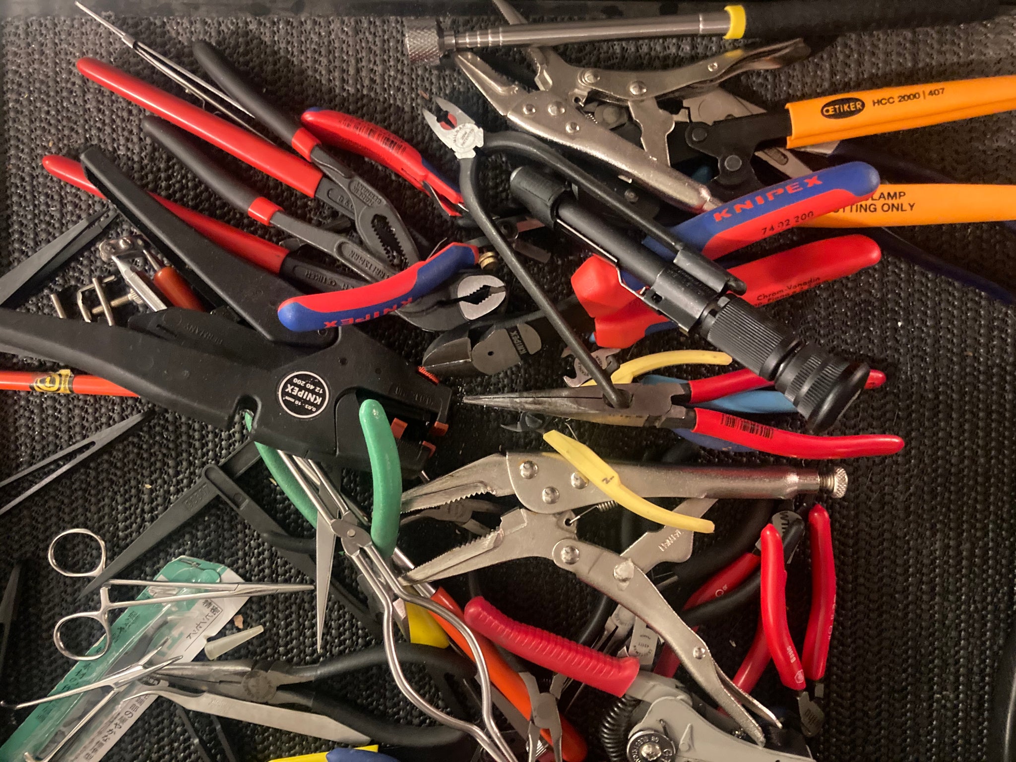 A drawer full of tools before foam organization